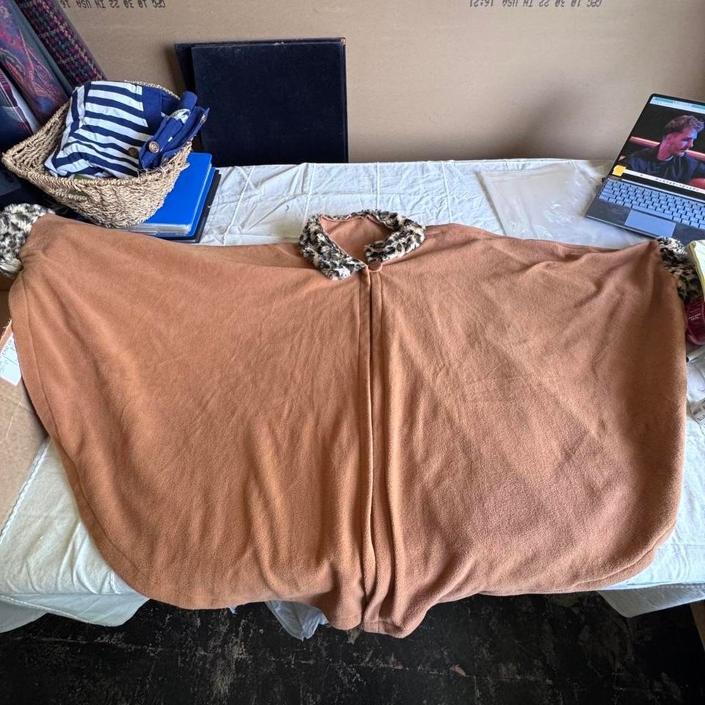 Tan polyester poncho with leopard print trim